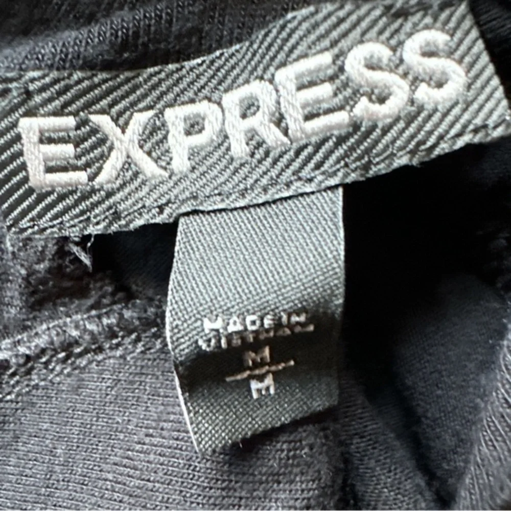 Express size medium, blacking sleeve super soft top, cut out back scoop hangs